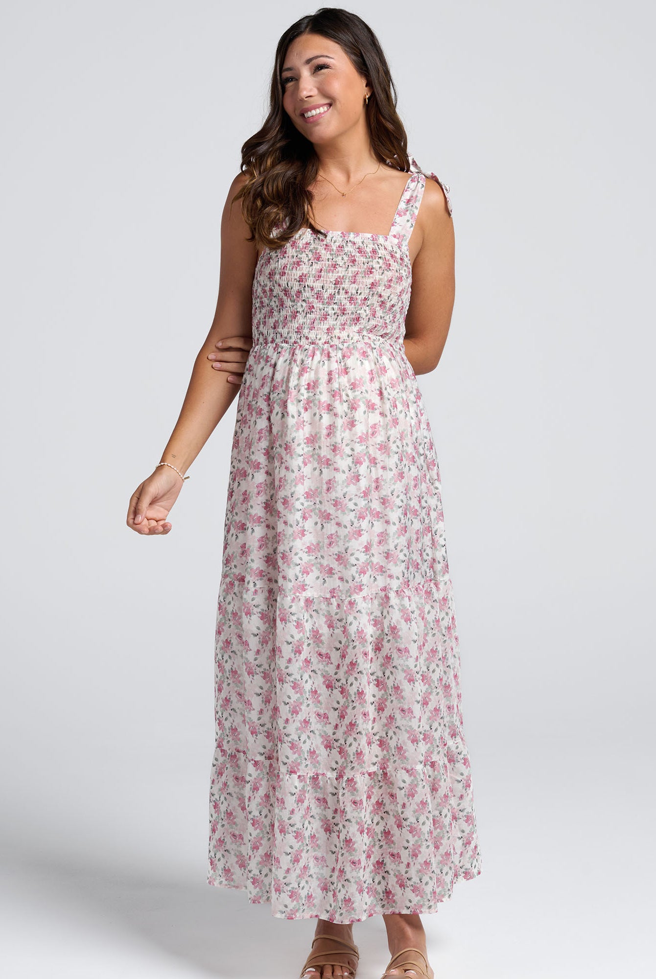 Woman wearing a floral dress on a white background