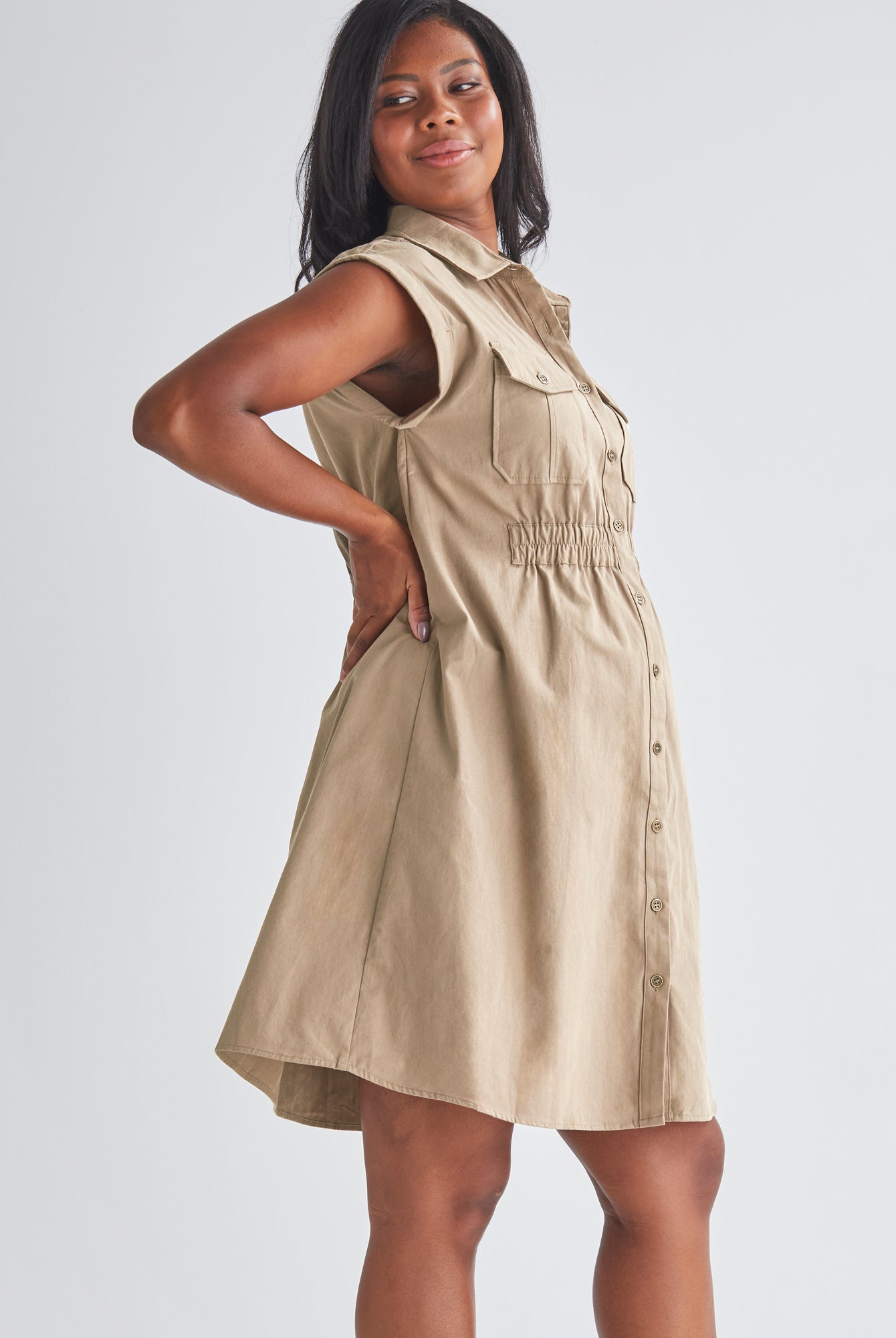 Side View - A Pregnannt Woman Wearing Kaya Maternity Safari Cotton Shirt Dress In Beige from Angel Maternity.