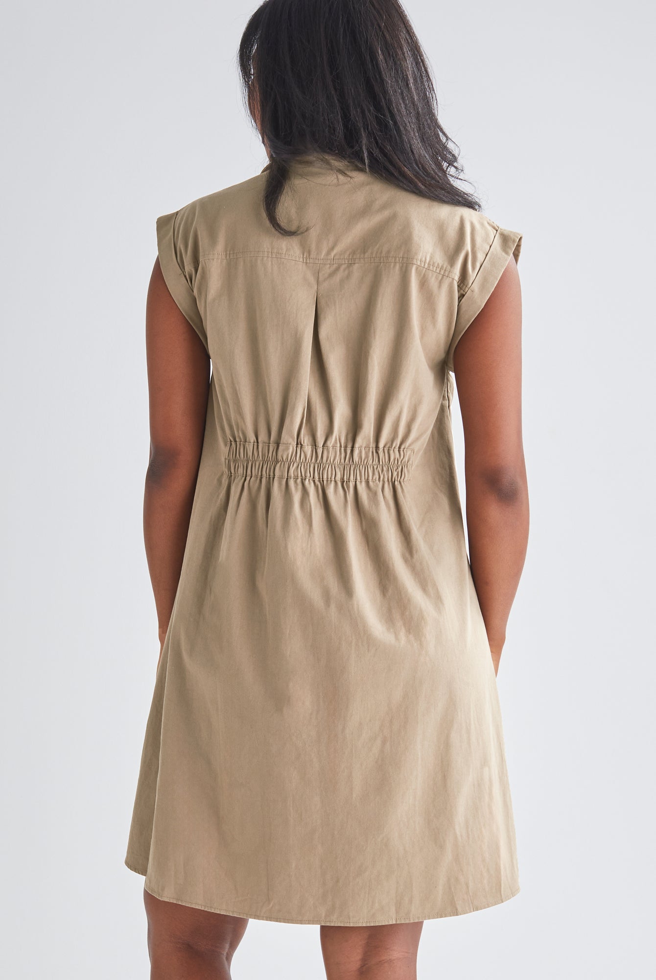 Back View - A Pregnannt Woman Wearing Kaya Maternity Safari Cotton Shirt Dress In Beige from Angel Maternity.