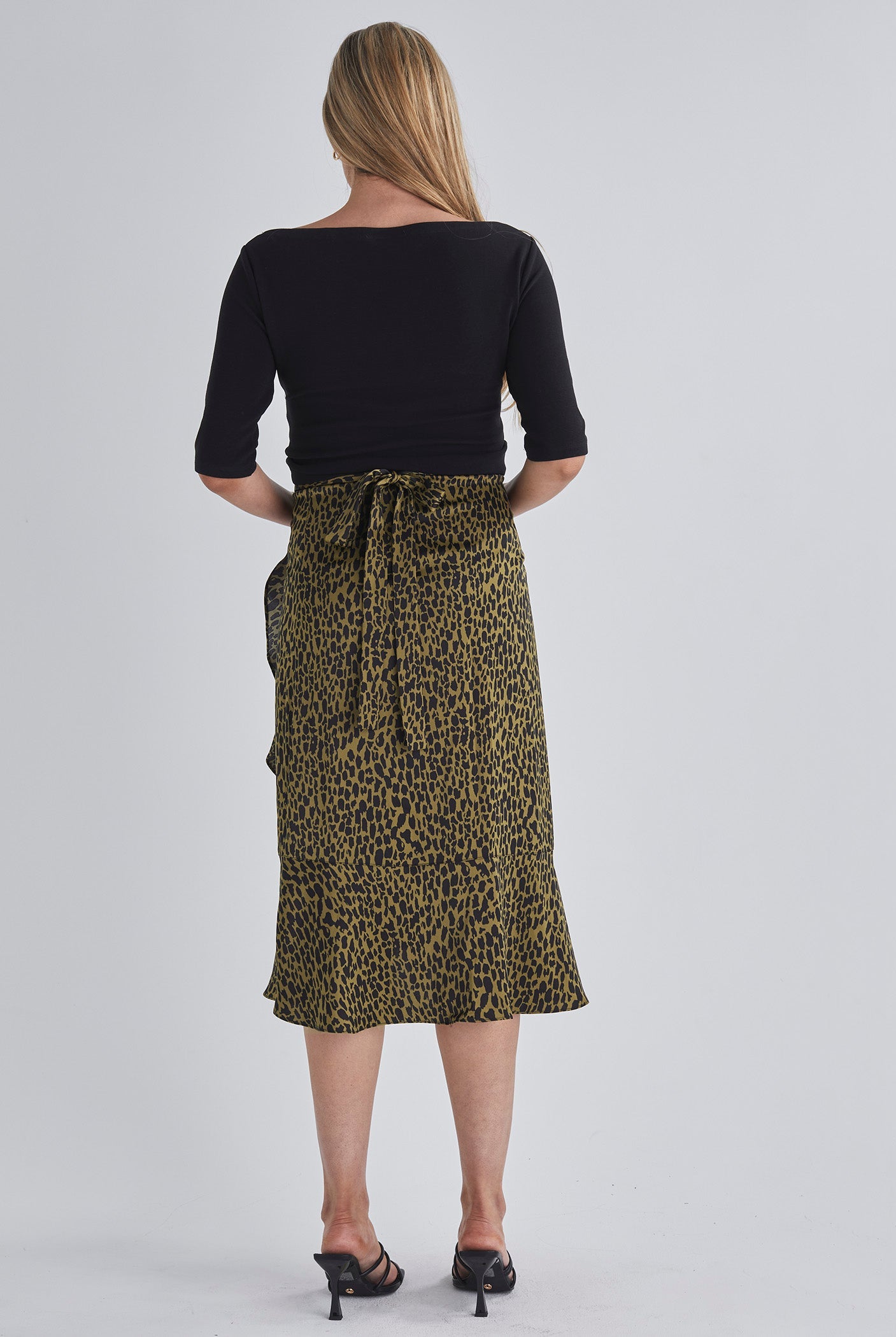 Back view-Throw on and go Midi skirt Designed to fit through all stages of pregnancy Wrap design Ruffled hem from AngelMaternity