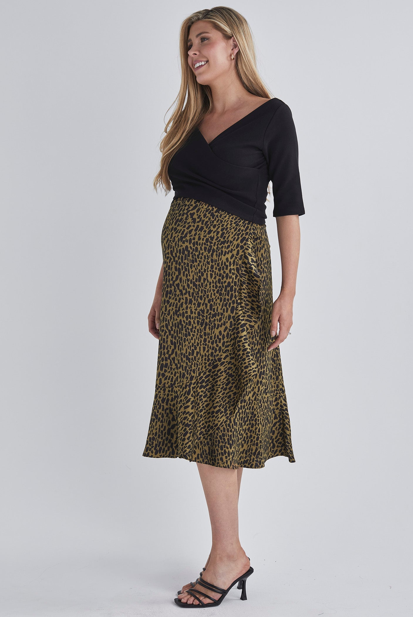 Side view-Throw on and go Midi skirt Designed to fit through all stages of pregnancy Wrap design Ruffled hem from AngelMaternity