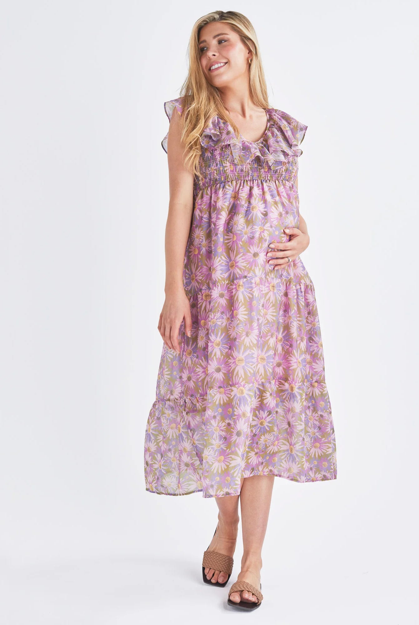 A Pregnant Woman Wearing Reversible Floral Maternity Baby Shower Dress in Lilac from Angel Maternity