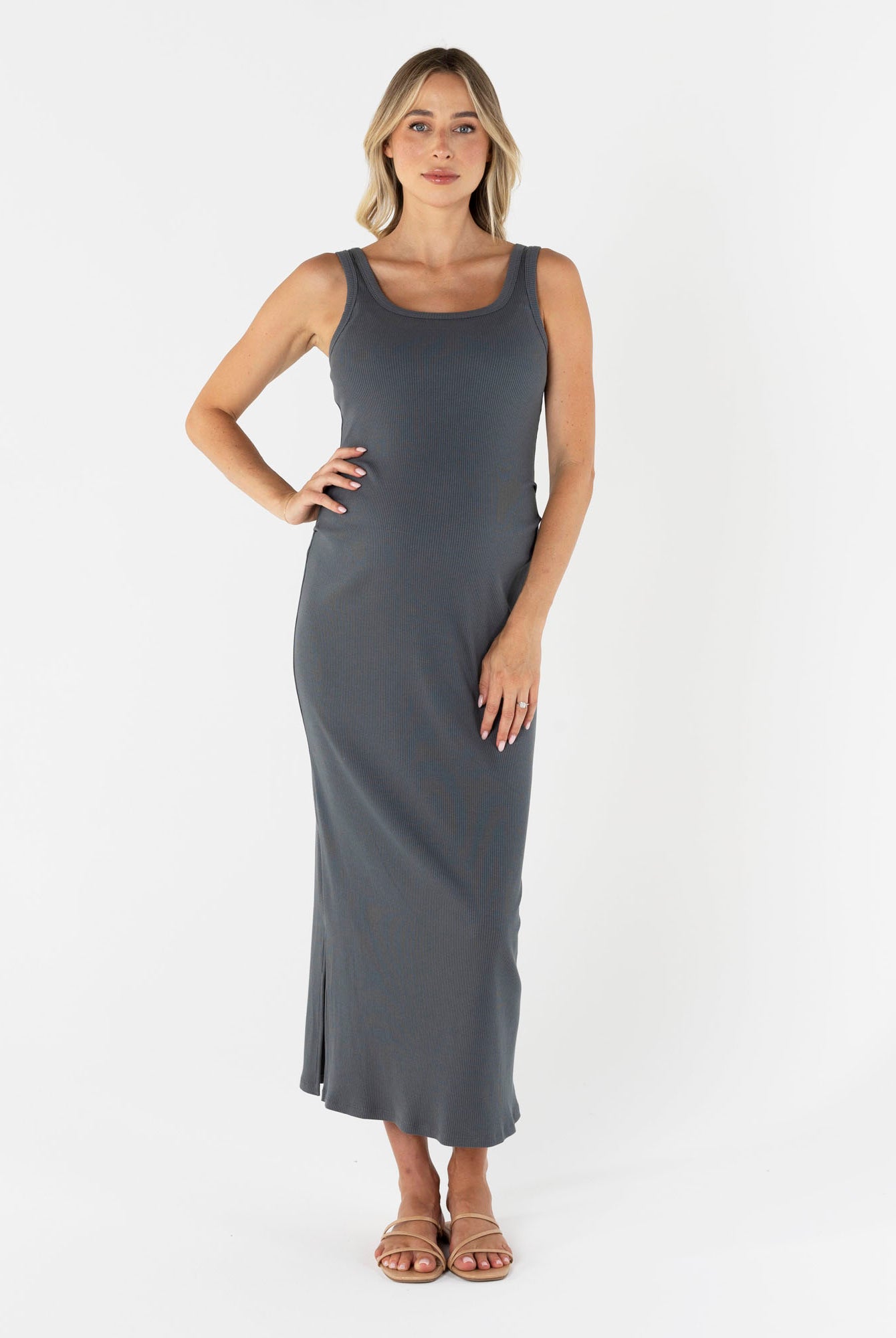 Woman wearing a gray sleeveless maternity basic maxi dress in grey