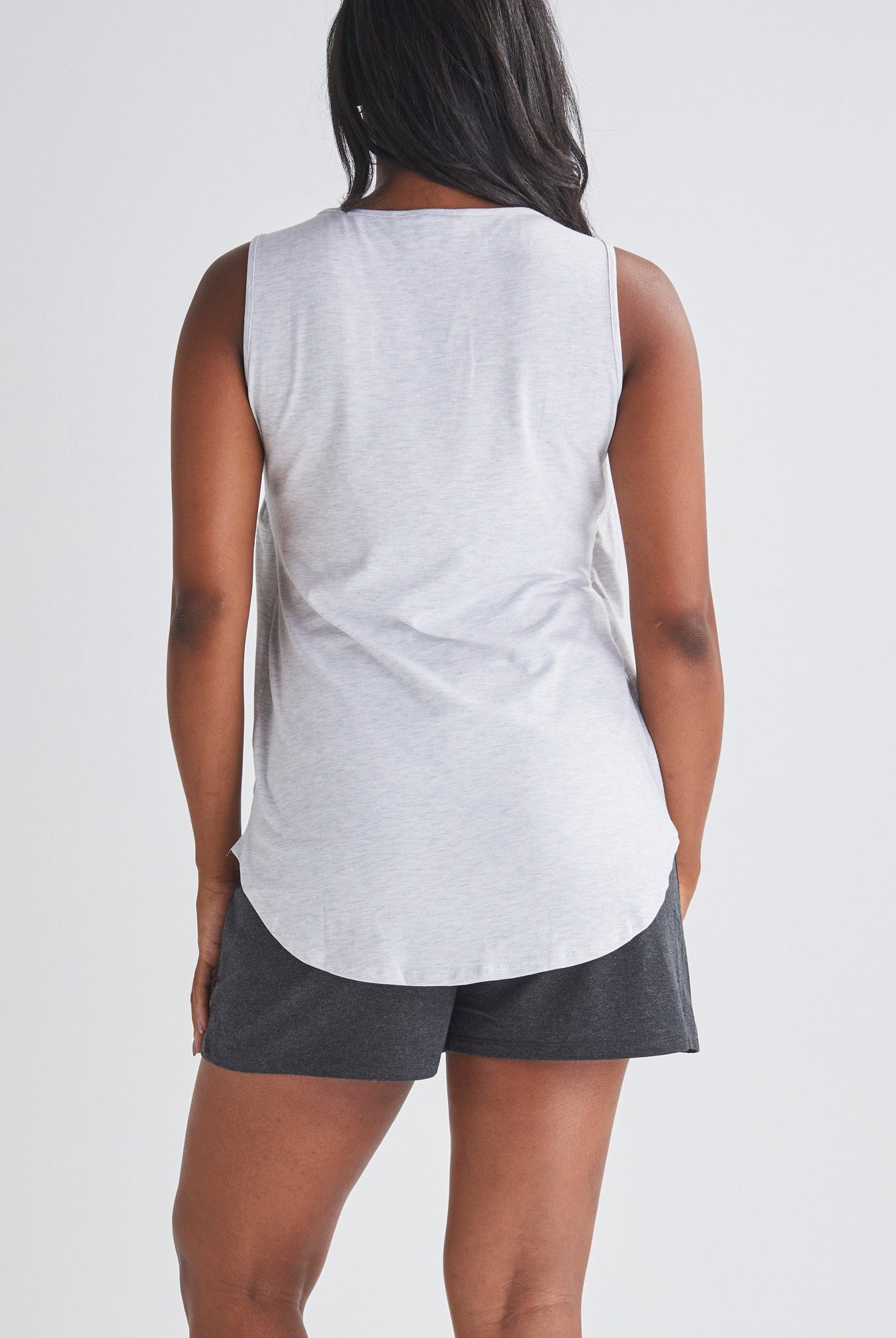 Back View - A Pregnannt Woman Wearing 2-piece Maternity/Nursing Pyjama Set - Top & Shorts from Angel Maternity.