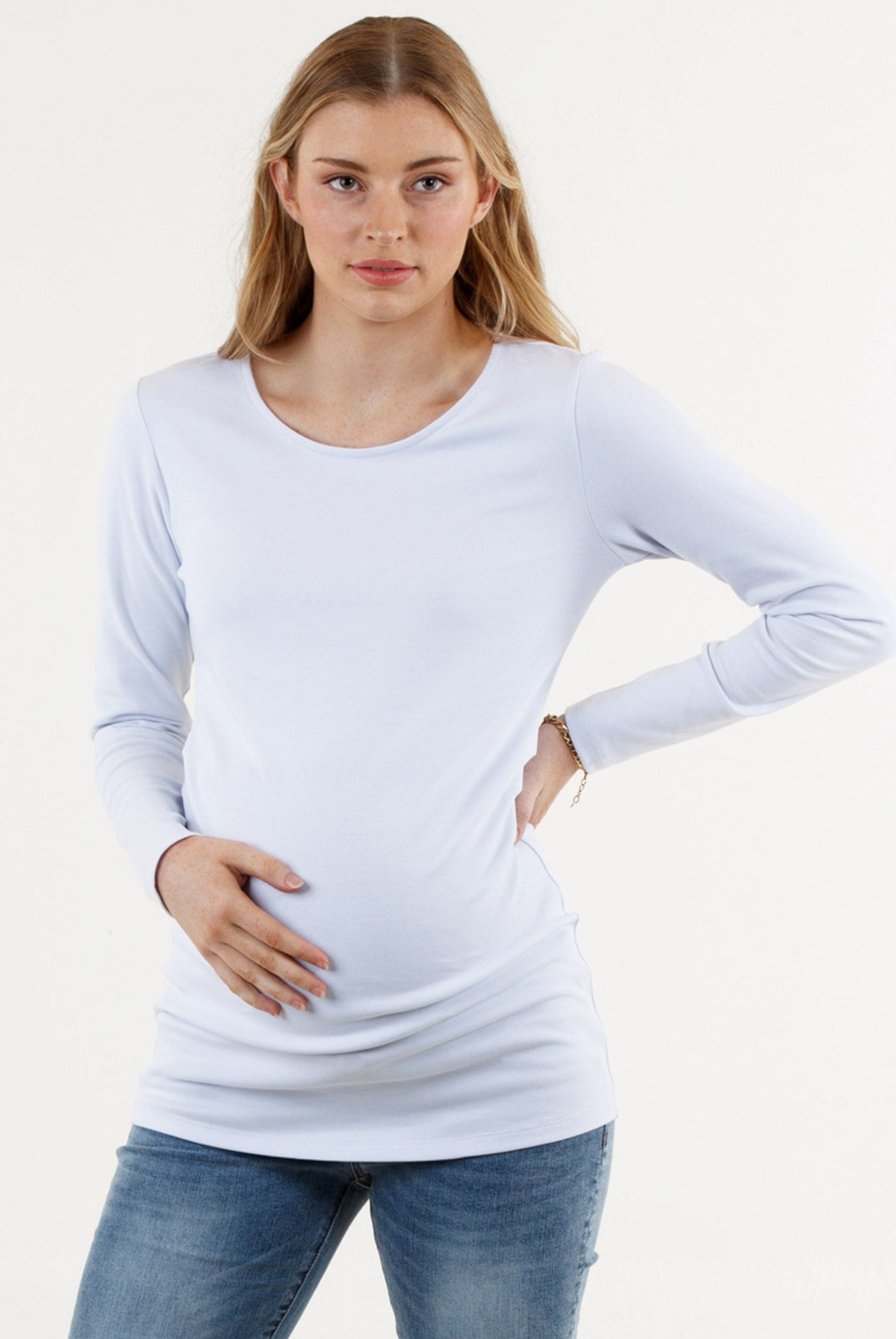 A young pregnant woman in Basic White Long Sleeve Cotton Maternity Top (6669517160542)