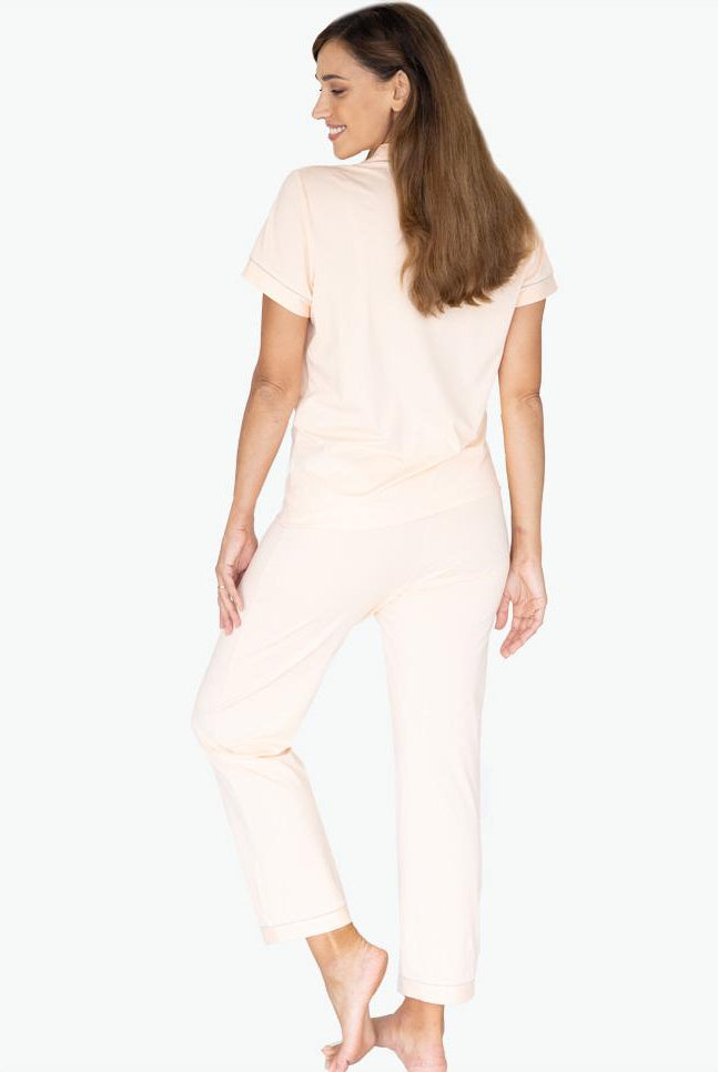 Back view - A young pregnant woman in Button Front Maternity & Nursing Pajama Set in Peach (6659036872798)