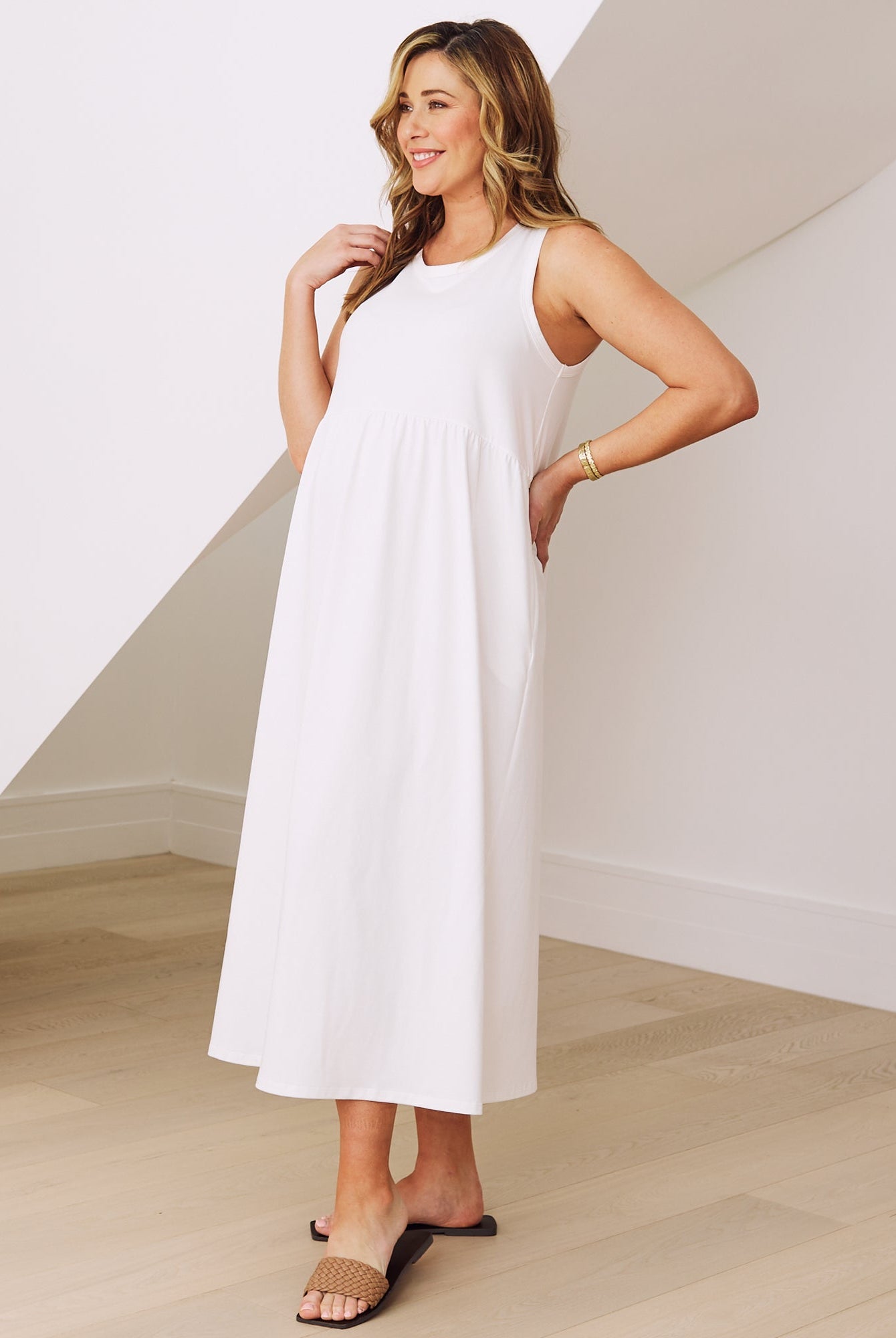 Side view- maternity relaxed fit cotton dress in white