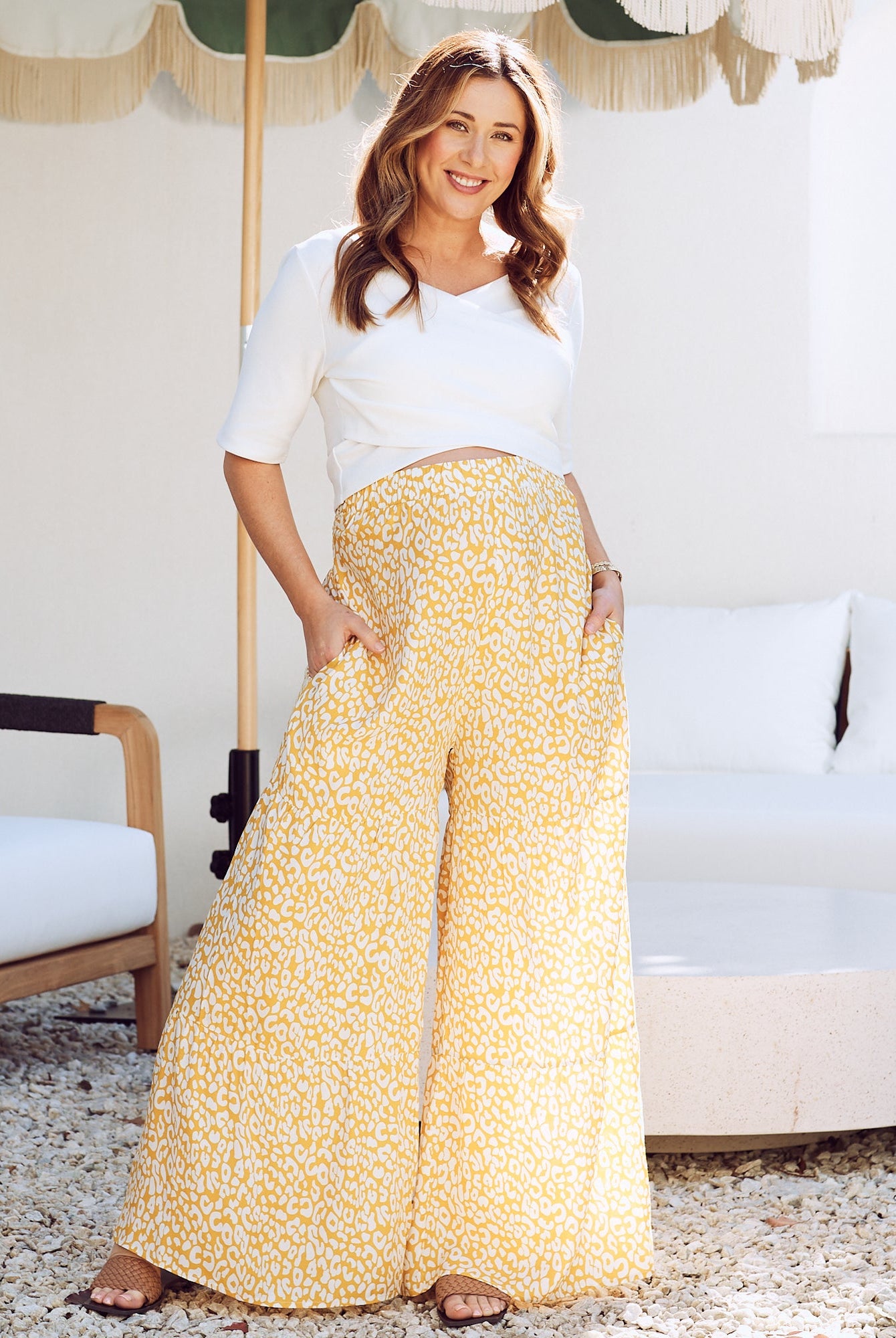 Front view - maternity wide leg pants in mustard print