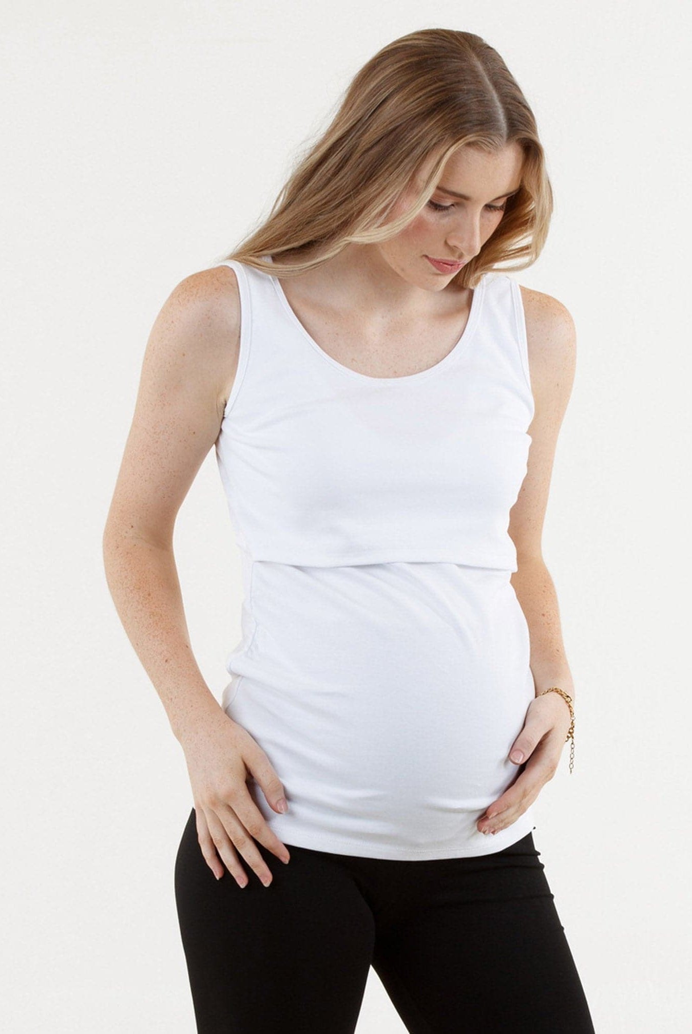 A Pregnannt Woman Wearing Maya Maternity & Nursing Cotton Tank in White from Angel Maternity.