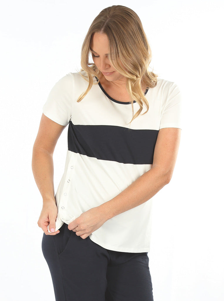  A young pregnant woman in Maternity and Nursing T-Shirt in Navy and White with Side Zip showing the zip opening for easy access to breastfedding  (6663267844190)