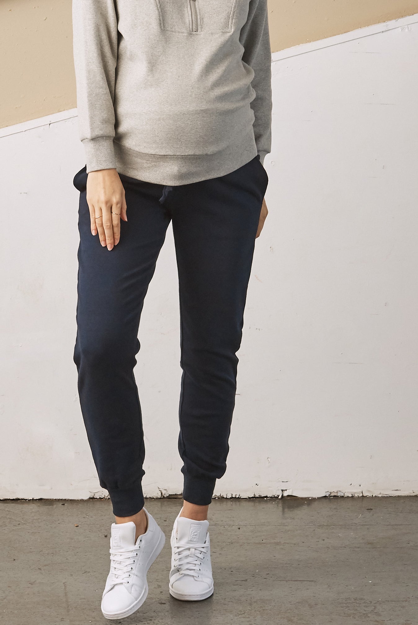 Main View - A Pregnant Woman in Essential Maternity Sweatpants in Navy Color (6728301707358)
