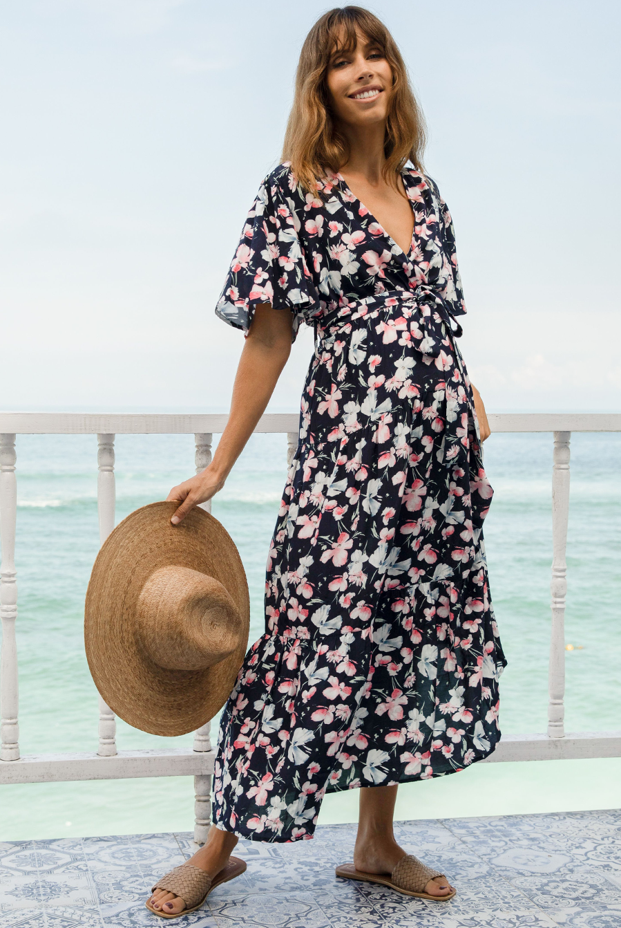 A woman in baby shower navy floral print maternity dress, front (6659011674206)