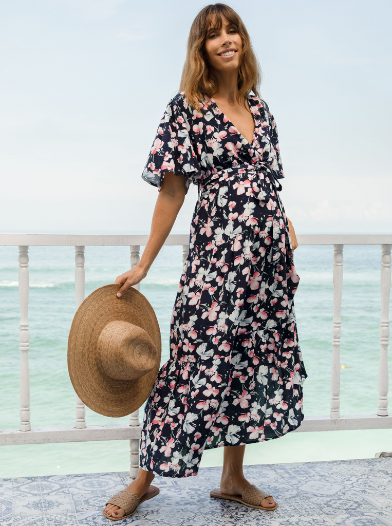 A woman in baby shower navy floral print maternity dress, front (6659011674206)