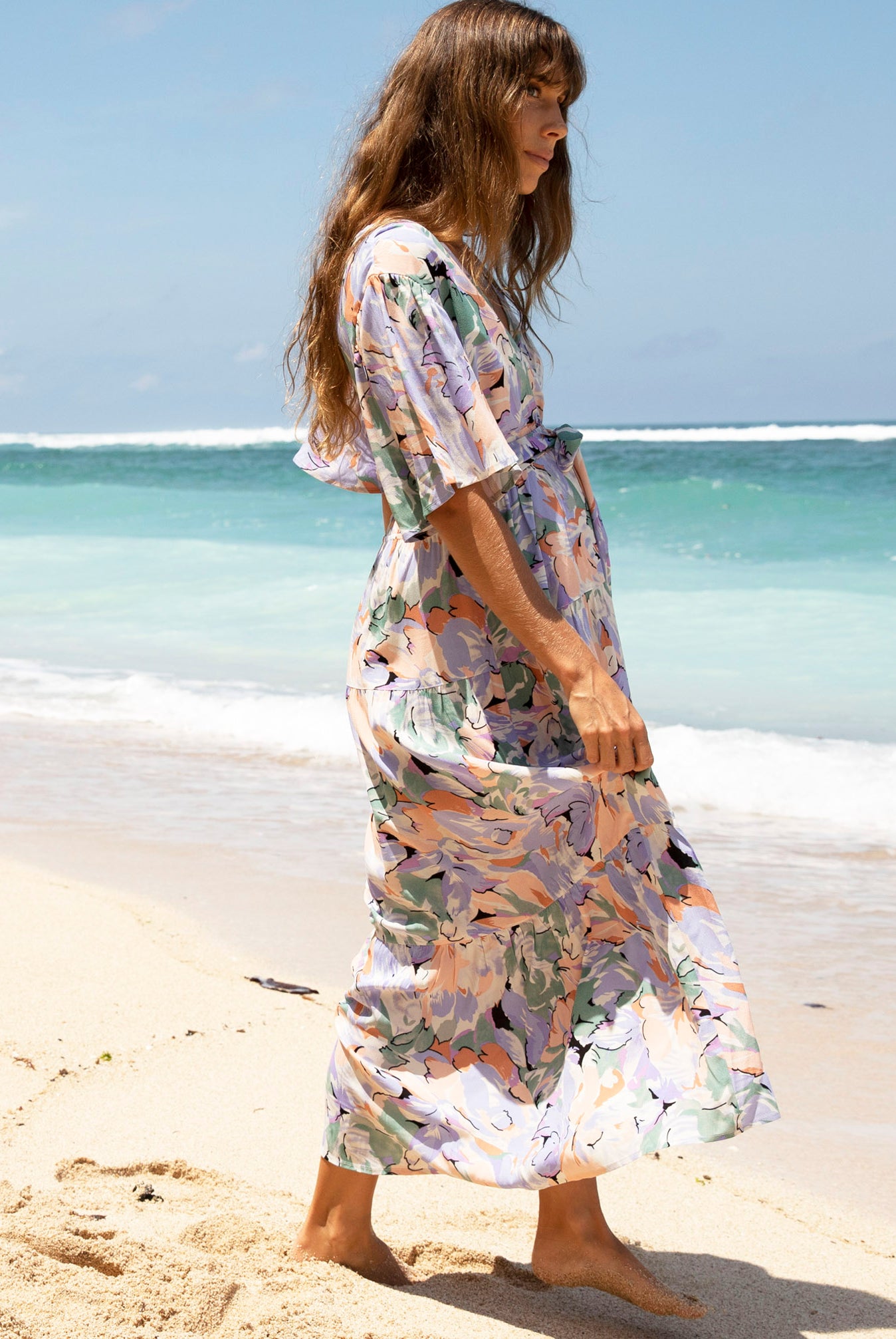 A woman in floral lavender maternity baby shower dress, (6672554033246)