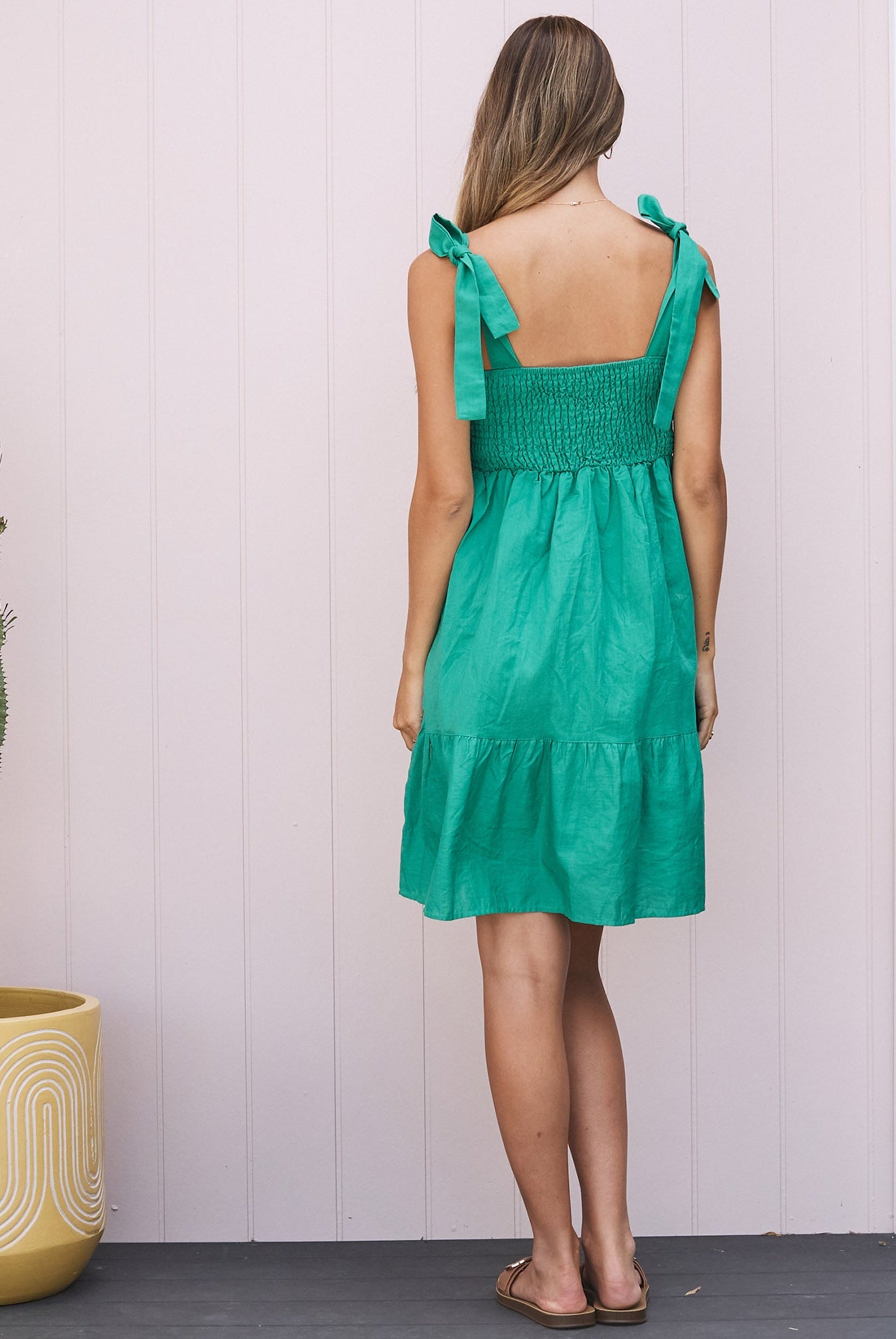Back View - A pregnant Woman in Maternity Summer Shirred Green Linen Dress - Shoulder Tie