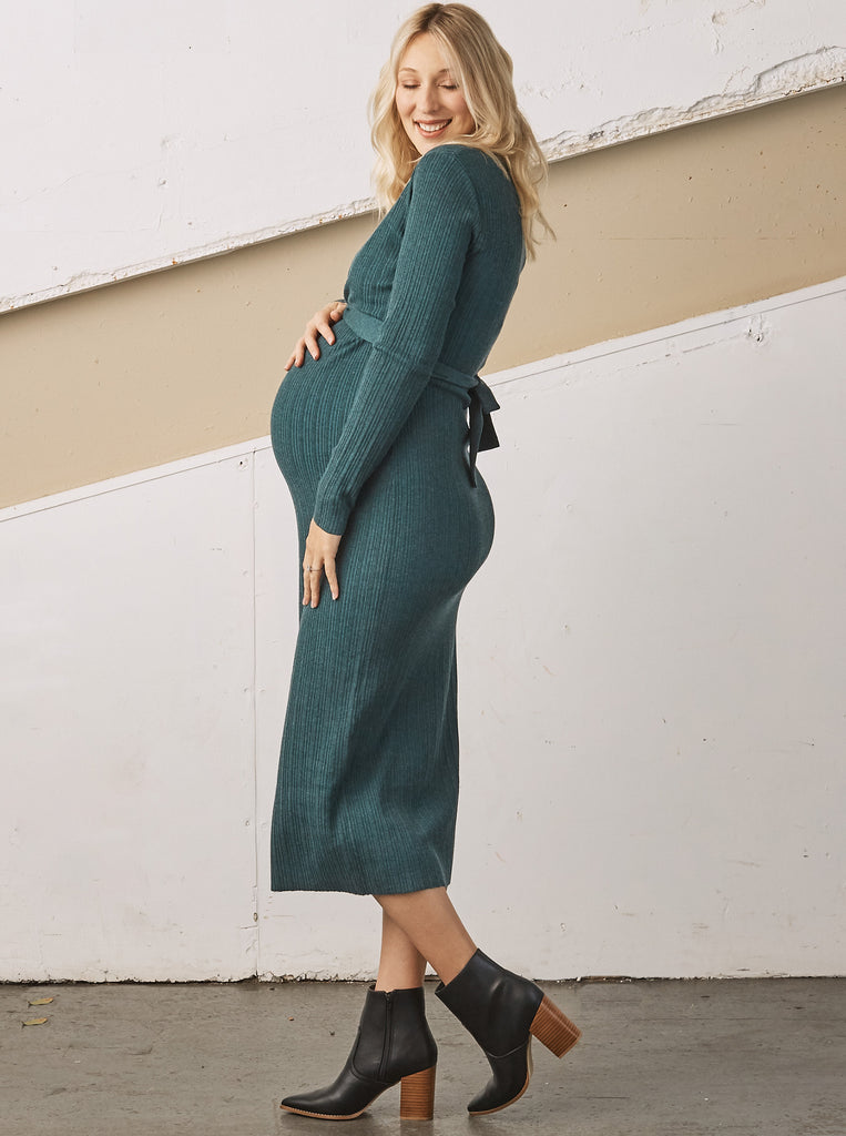 Side view - A Pregnant Woman i  Annabella Knit Teal Maternity Bodycon Midi Dress touching her bump & smiling (6726615924830)