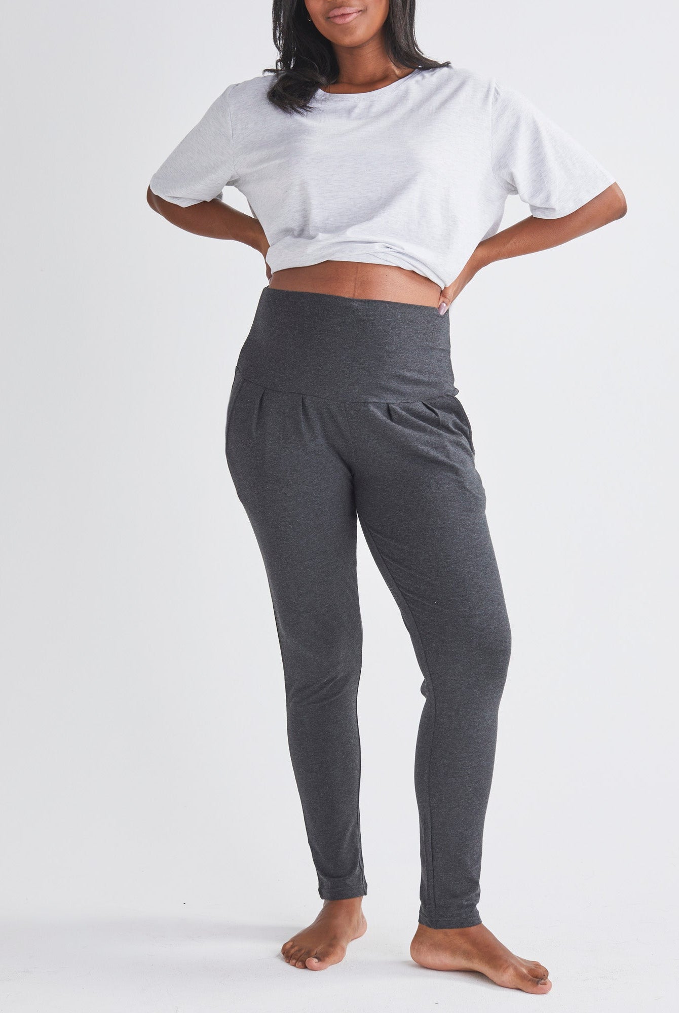 A Pregnannt Woman Wearing Eden Ultra Soft Maternity Lounge Pants in Charcoal from Angel Maternity.