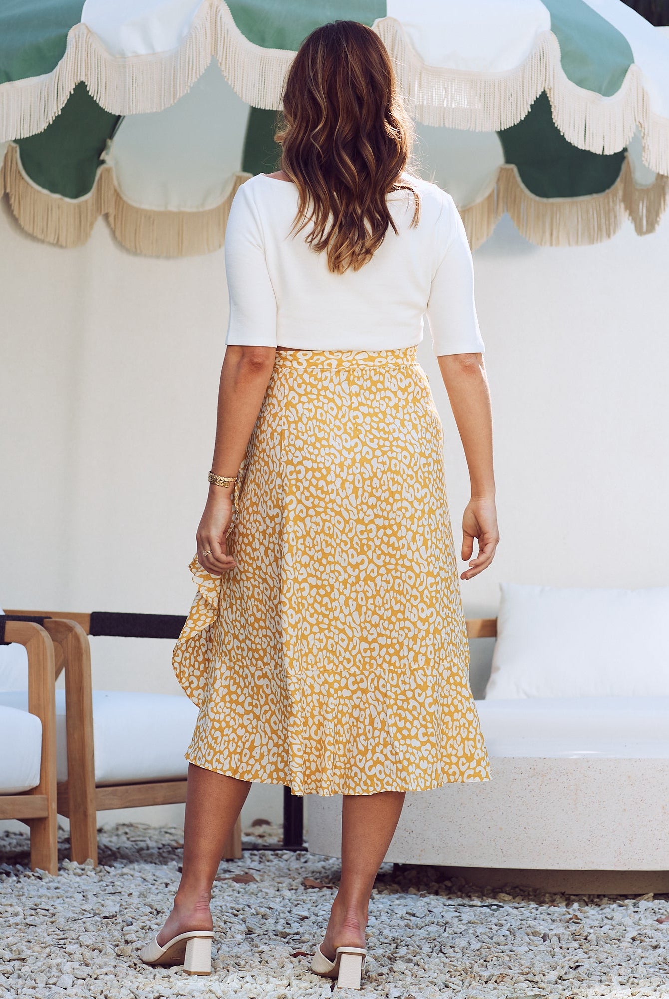 Back view - maternity wrap ruffled skirt in mustard leopard print