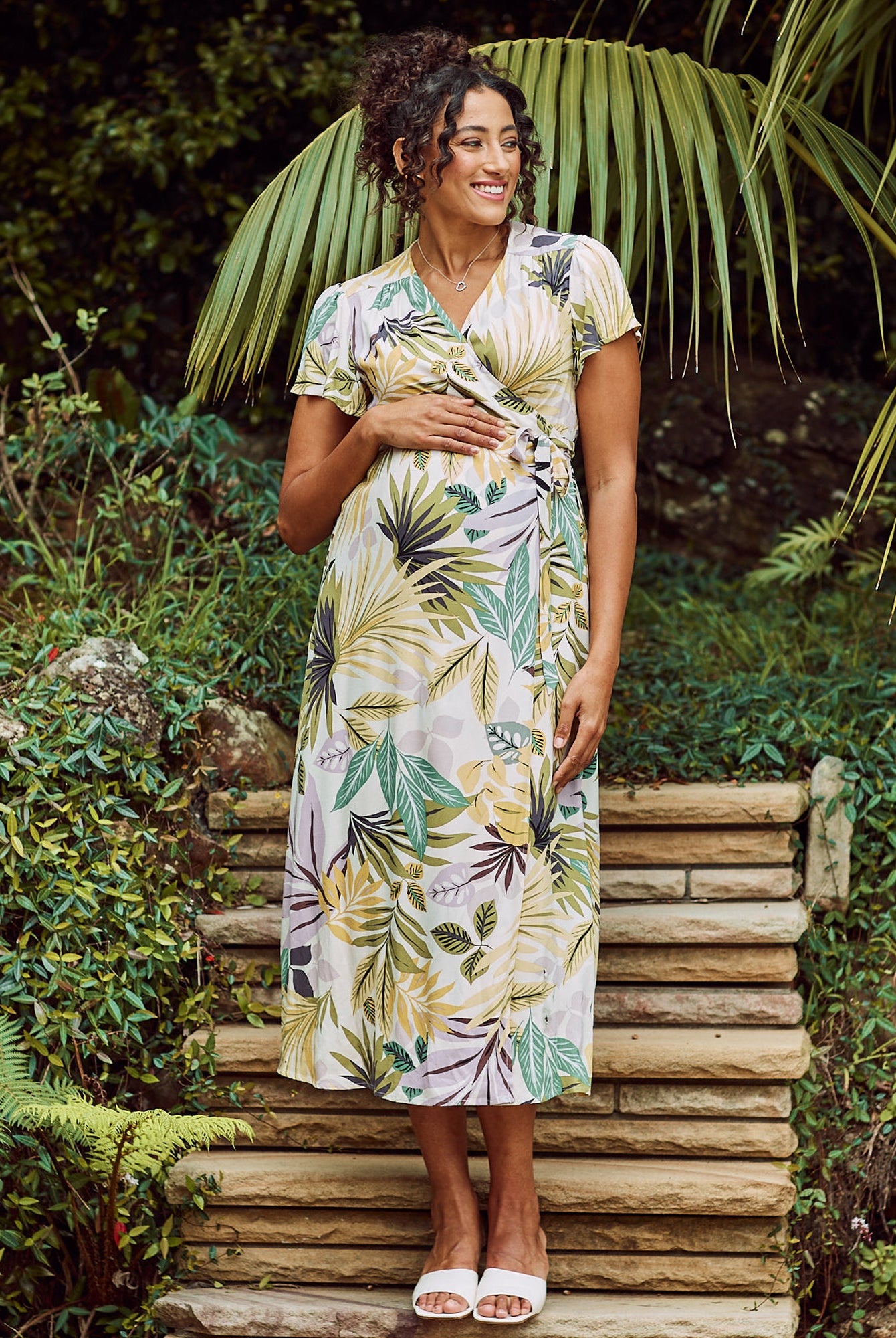 Front View - Maternity v neck wrap dress in green flora