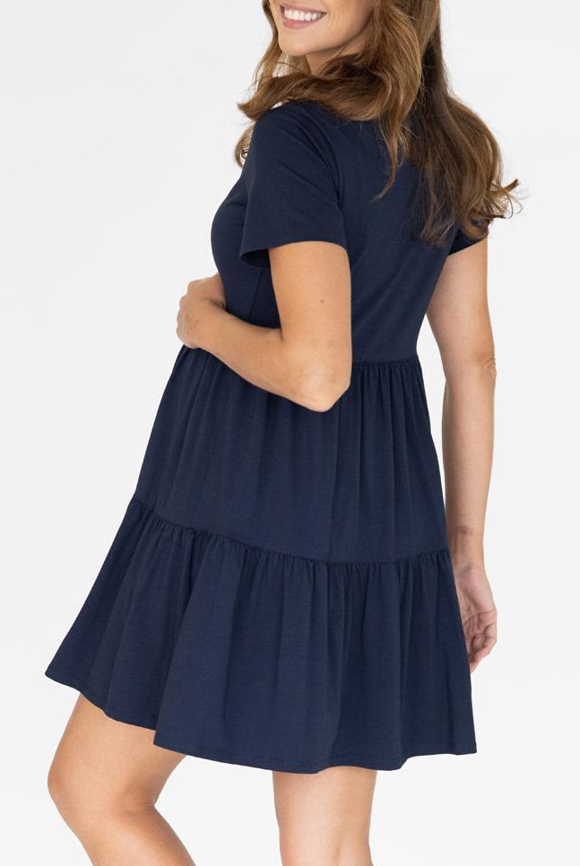 A woman in navy maternity tiered dress, back (4827569651806)