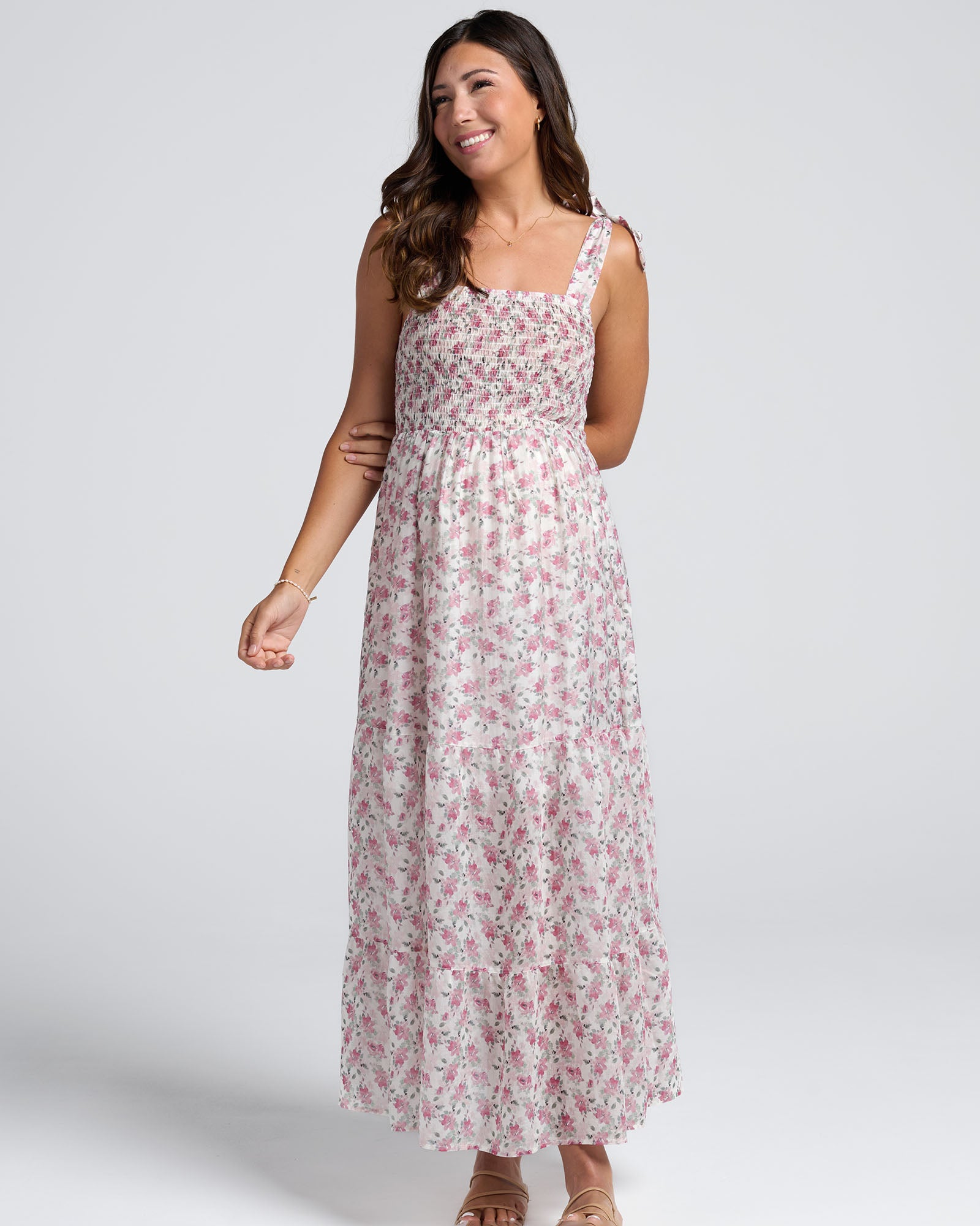 Woman wearing a floral dress on a white background