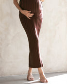 pregnant lady wearing a brown ribbed maternity skirt in chocolate brown