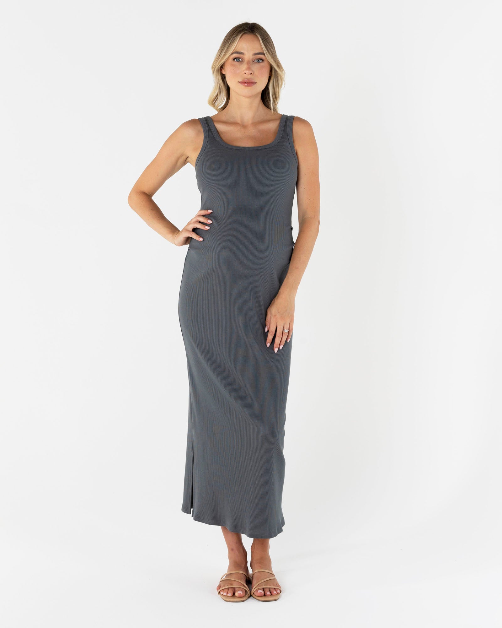 Woman wearing a gray sleeveless maternity basic maxi dress in grey