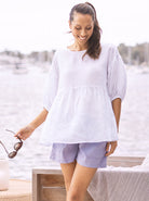 Main View - A Young Pregnant Woman in White Maternity Linen Blouse Top