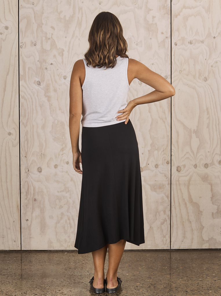 Back View - A Pregnannt Wearing Woman Becky Maternity Bamboo Maxi Skirt in Black from Angel Maternity.