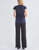 Back View - A Pregnant Woment Wearing Elodie Wide Leg Maternity Black Work Pant in Ponti from Angel Maternity Australia