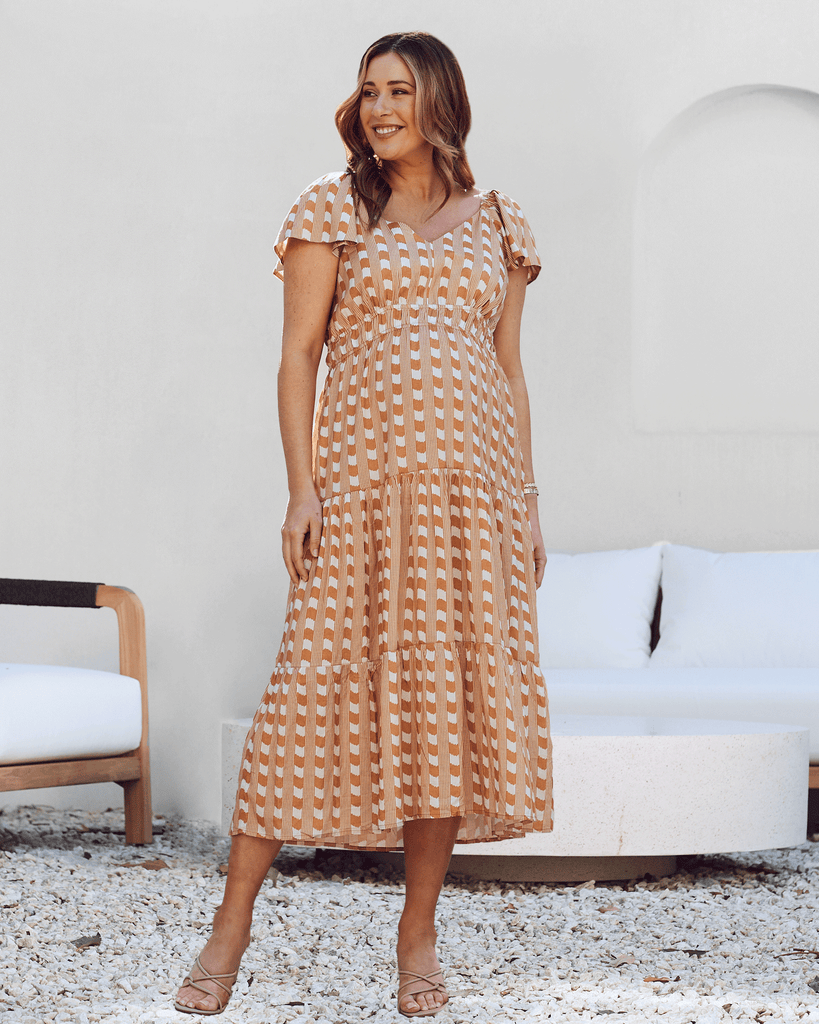 front view - Maternity ruffled baby shower dress gingham camel