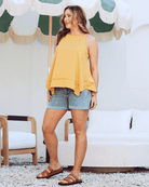 Side view- maternity asymmetric cotton tank top mustard