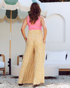 back view - maternity wide leg pants in mustard print