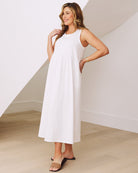 Side view- maternity  relaxed fit cotton dress in white