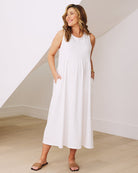 Front view- maternity  relaxed fit cotton dress in white