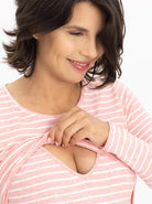 Close view - A pregnant woman in long sleeve pink maternity & nursing Cotton t-shirt smiling & showing easy breastfeeding access (6724307845214)