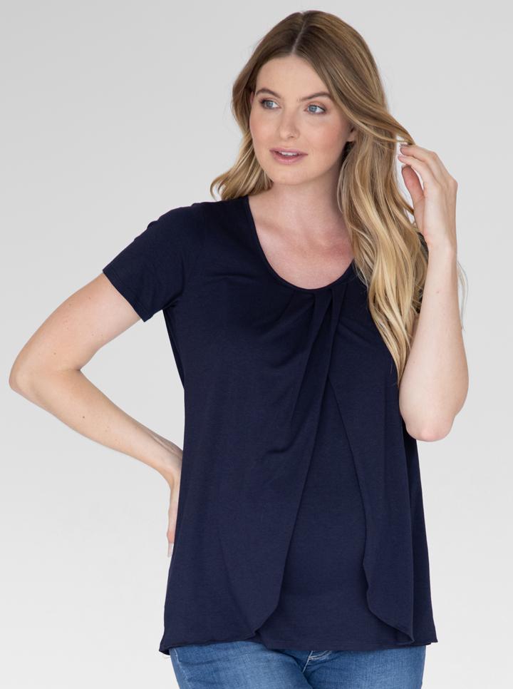 Front view - A woman in petal front short sleeve nursing top in navy (4828435513438)