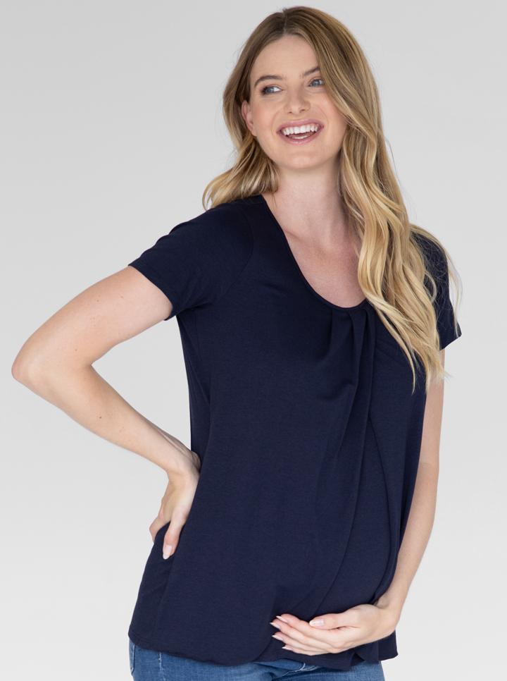 Main view - A woman in petal front short sleeve nursing top in navy smiling (4828435513438)