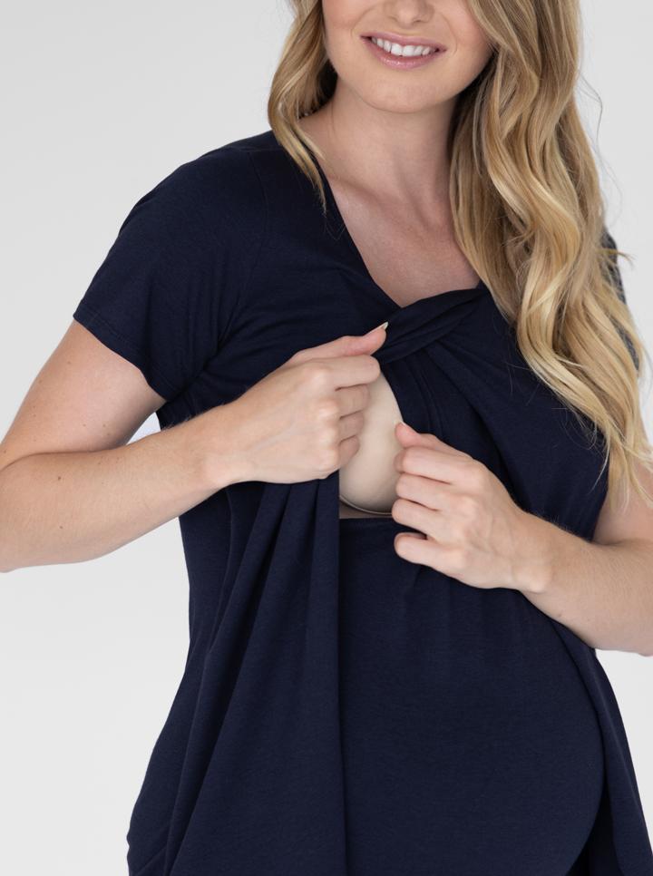 A woman in petal front short sleeve nursing top in navy showing easy acces to breastfeeding (4828435513438)