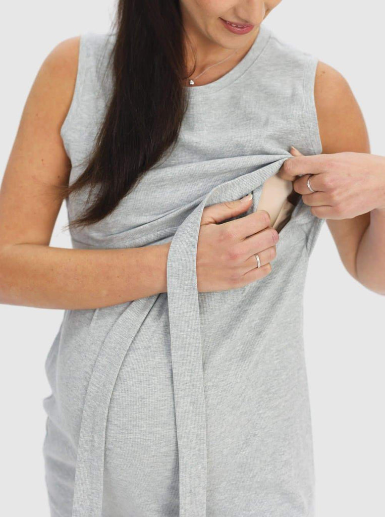 A pregnant woman in Sleeveless Maternity & Nursing Tie Knot Dress in Marl Grey showing easy access to breastfeed (6640546840670)
