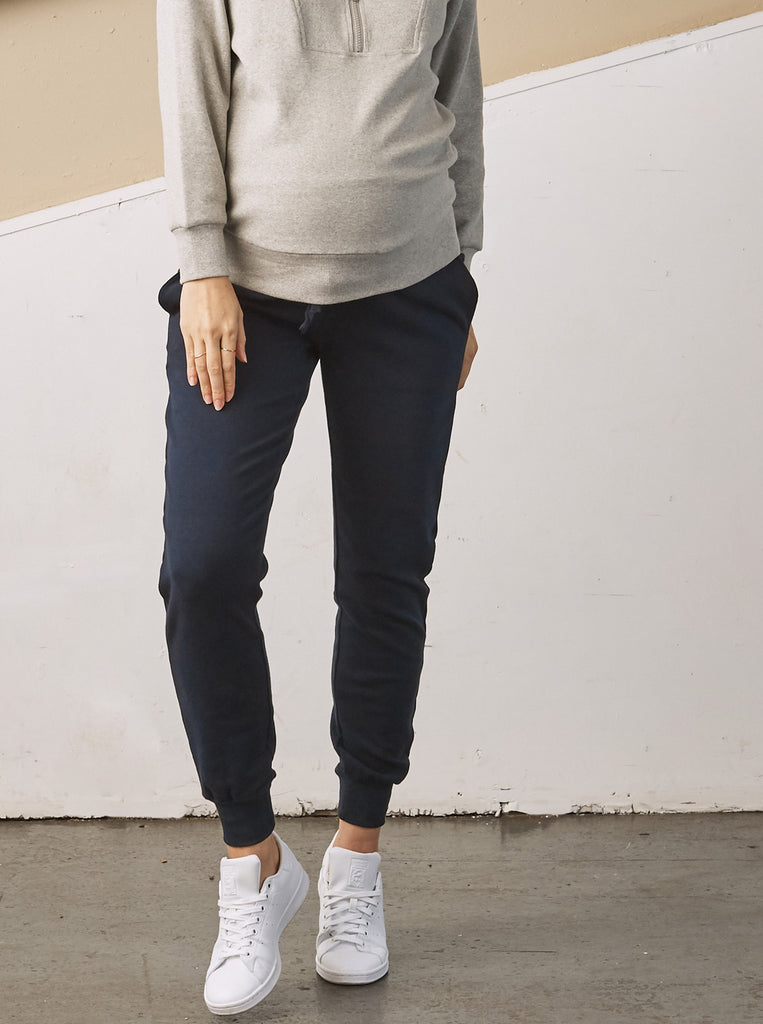 Main View - A Pregnant Woman in Essential Maternity Sweatpants in Navy Color (6728301707358)