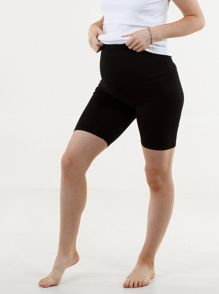A woman in black maternity bike shorts, main (4801471578206)