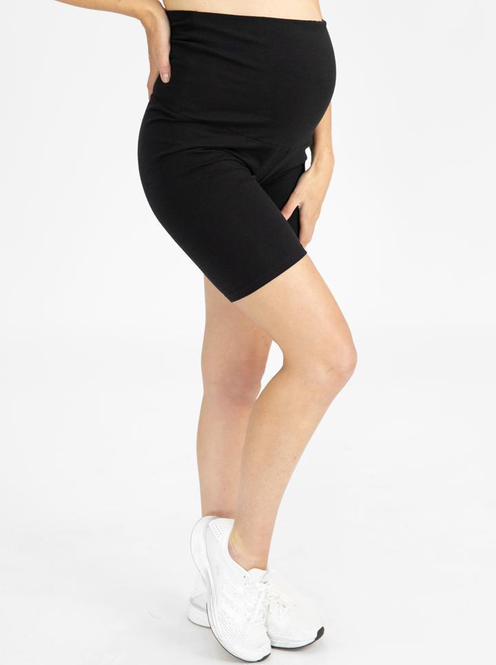 A woman in black maternity bike shorts, side (4801471578206)