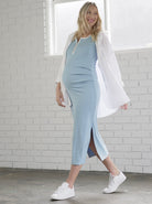 Side view - A Pregnant Woman in Skye Blue Fitted Maternity Midi Dress walking (6726602883166)