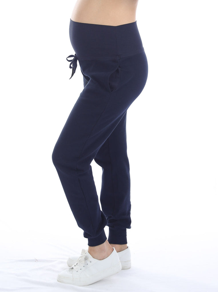 Side view - A pregnant woman in 2-Piece Calla zip front black Maternity Track Pants (6718252810334)