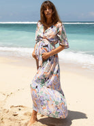 Main view - A woman in floral lavender maternity baby shower dress, (6672554033246)