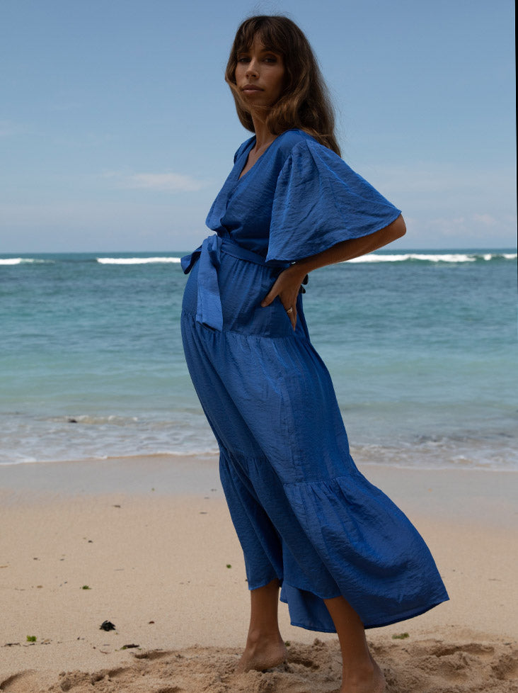 A woman in cobalt blue maternity dress, side (6659011641438)