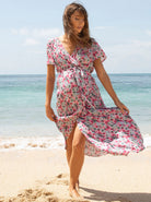 A woman in floral pink maternity & nursing wrap dress, main (6672544006238)