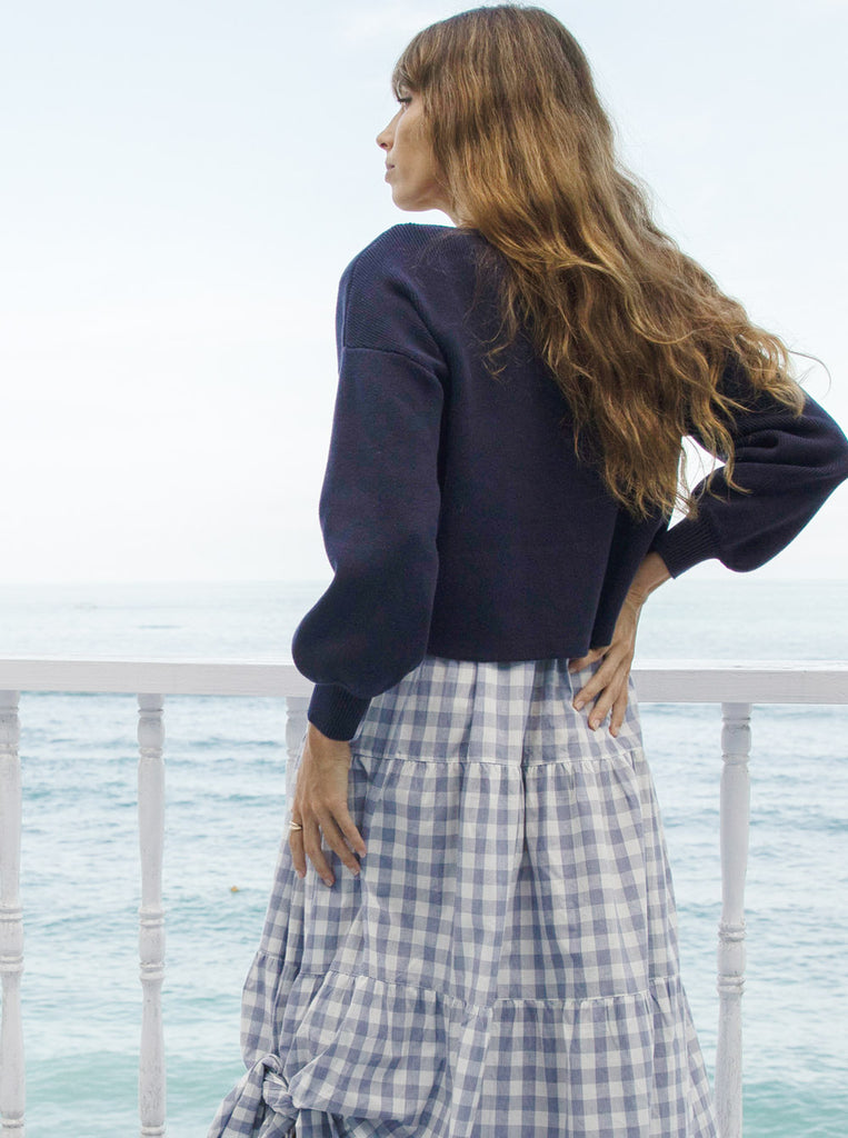 Back view - A Pregnant Woman in Long Sleeve Navy Cotton Maternity Top on seafront balcony (6621360193630)