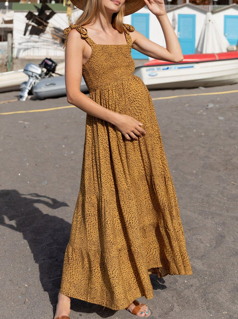 A woman in mustard print maternity dress, front (6656901152862)